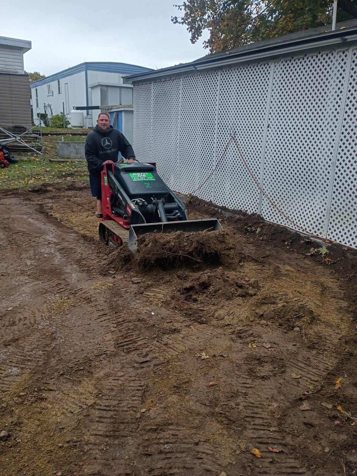 Dig out: digging the strip out with a mini track loader